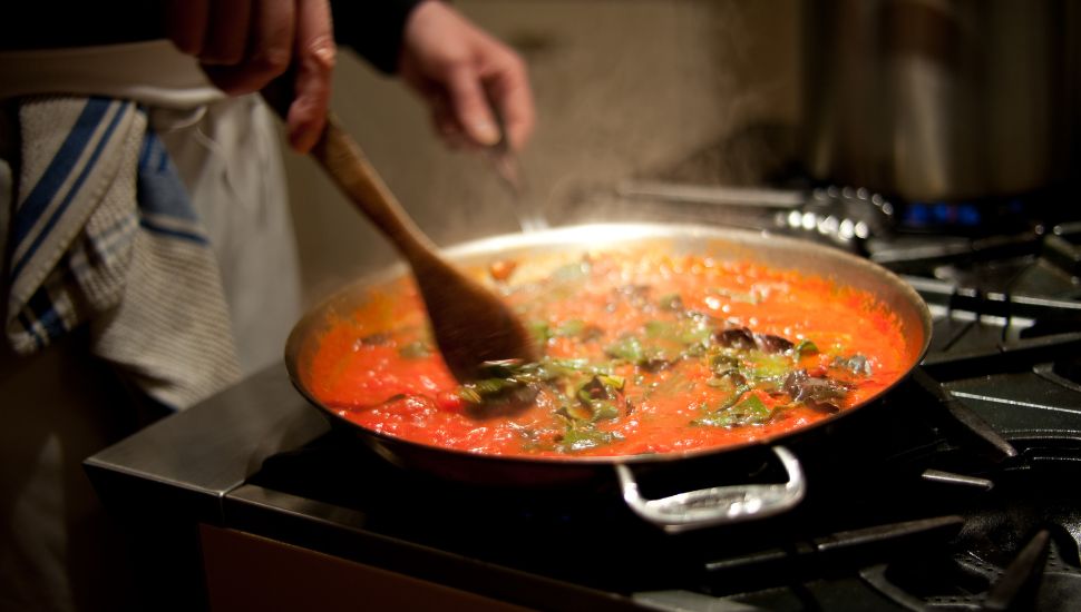 a person frying past a sauce