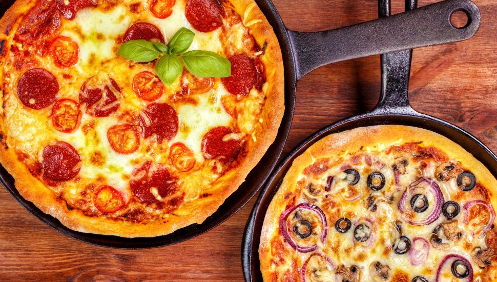 Image of two pizza's in pan