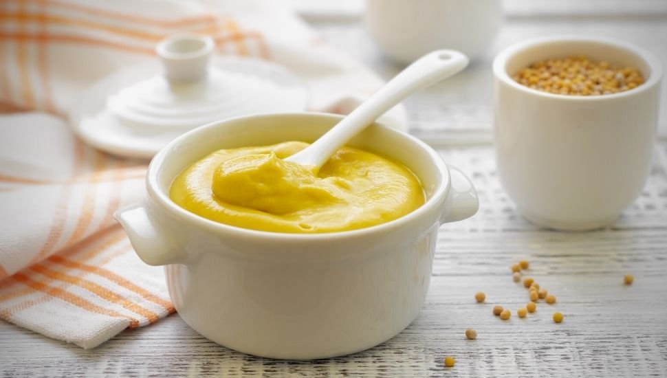 Mustard sauce in small white bowl