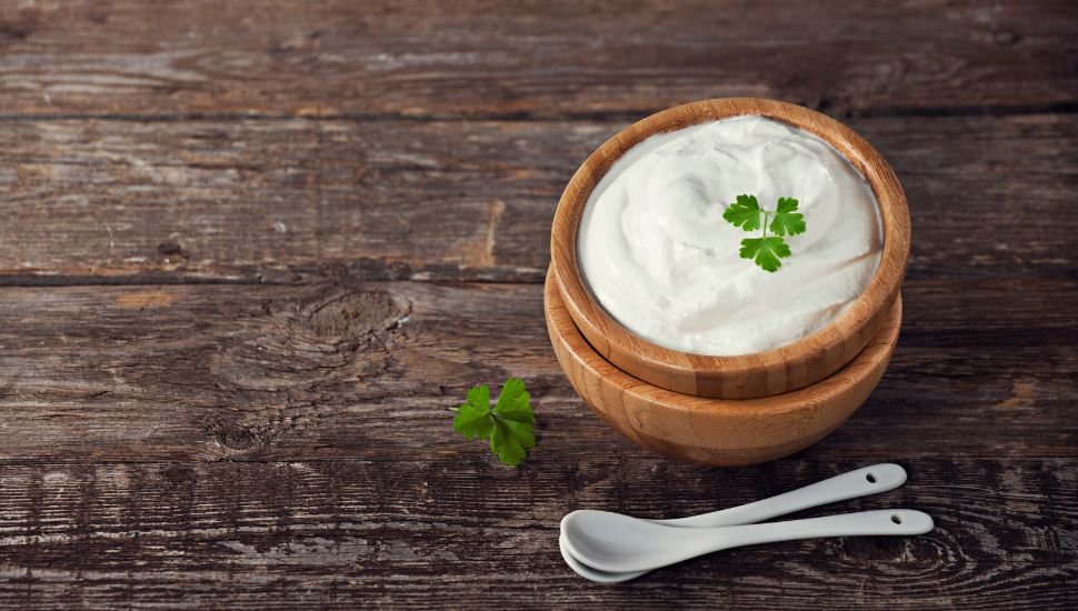 Sour Cream in a wooden bowl