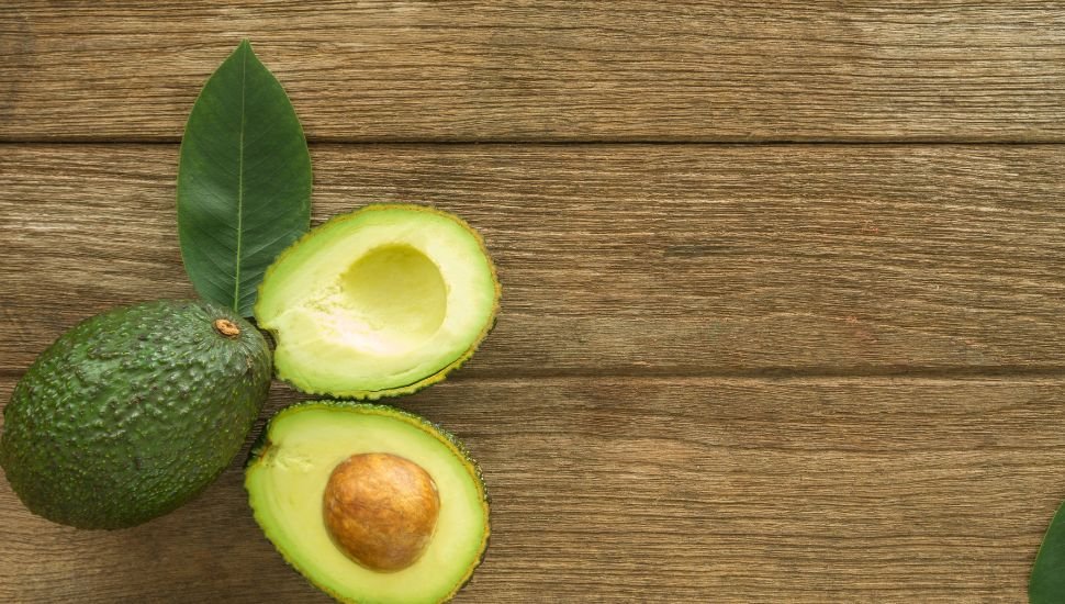 image of Avocados on a wooden table