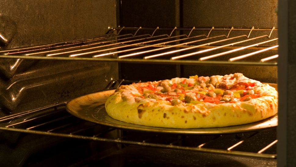 image of making pizza in oven