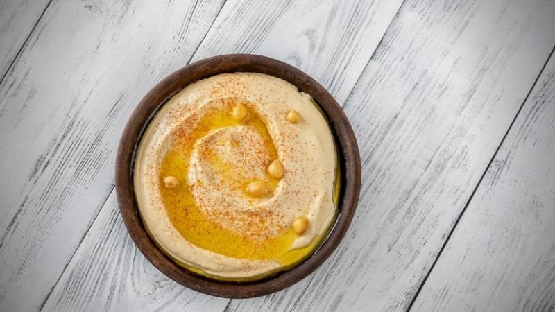 hummus in a wooden bowl