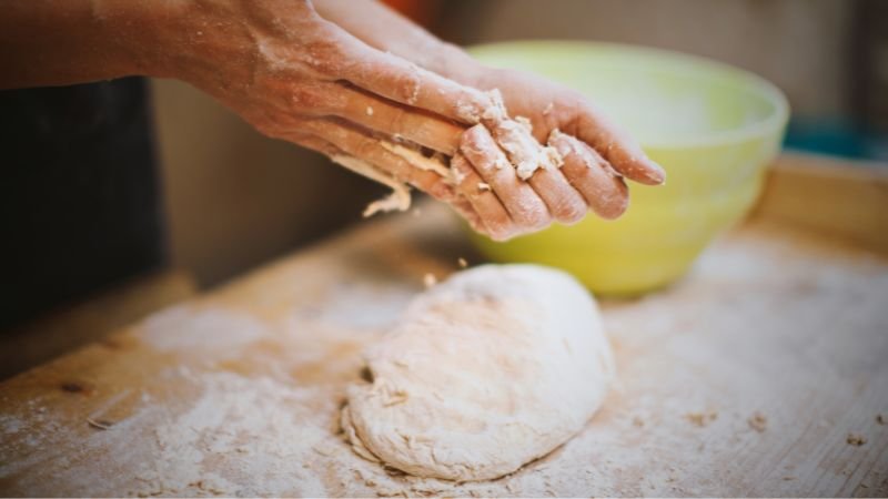 a person just finished kneading a dough