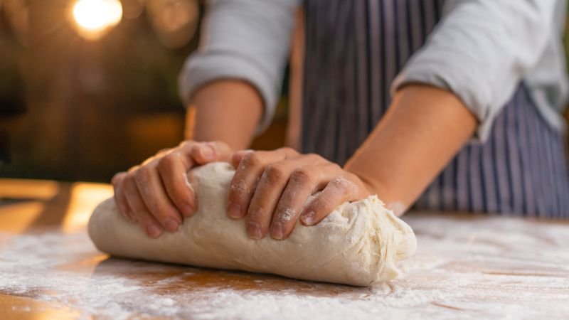 kneading pizza dough