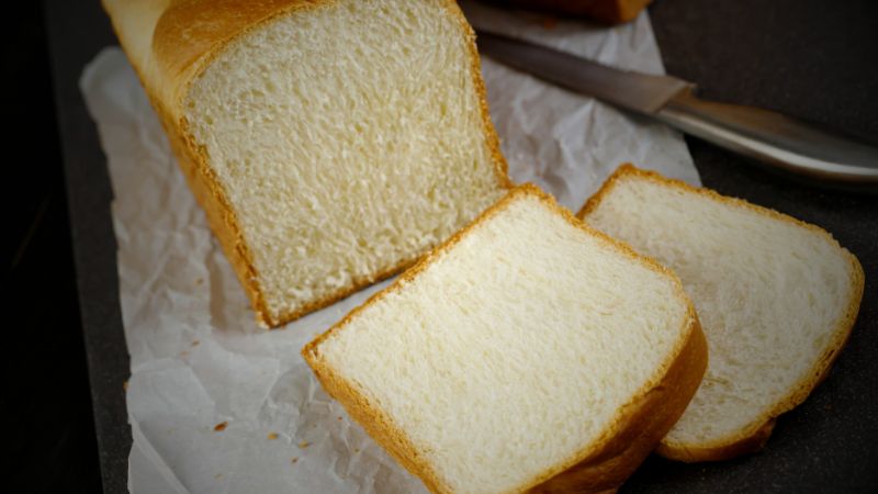 a piece of white bread loaf