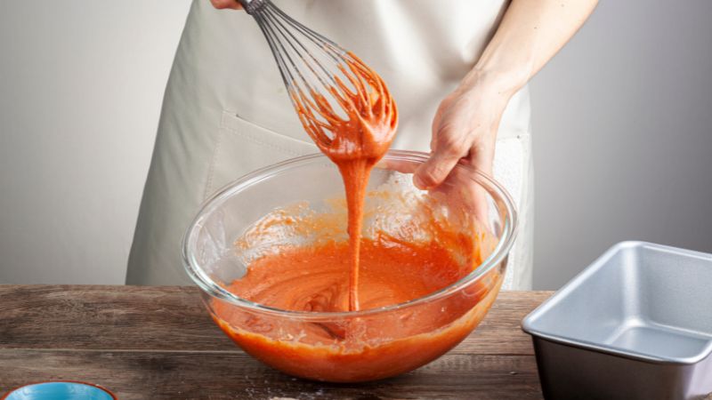 image of a person mixing cake mix