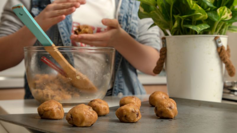 making balls of cookie dough