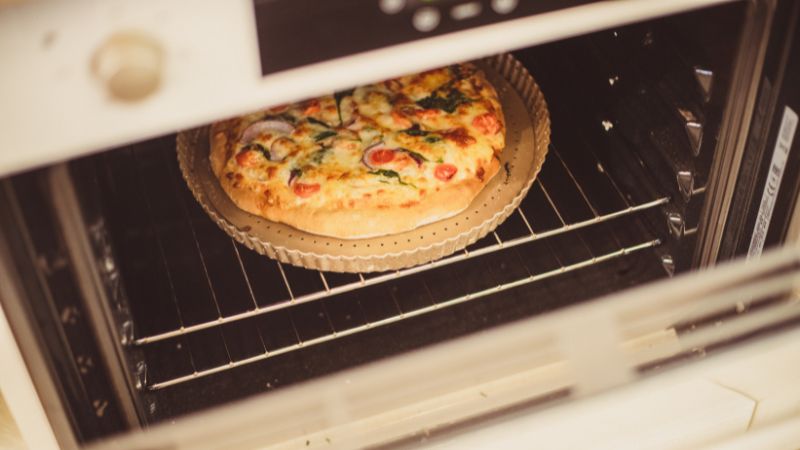 snap of a pizza inside an oven