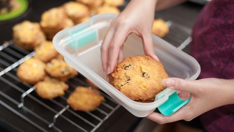 image of putting cookies in airtight container